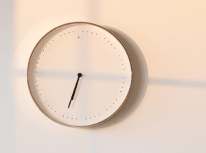 Analog clock on a blank wall