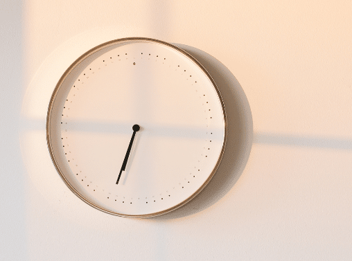 Analog clock on a blank wall